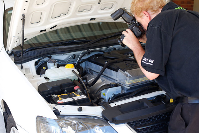 Photographing the engine as part of a vehicle inspection in Perth