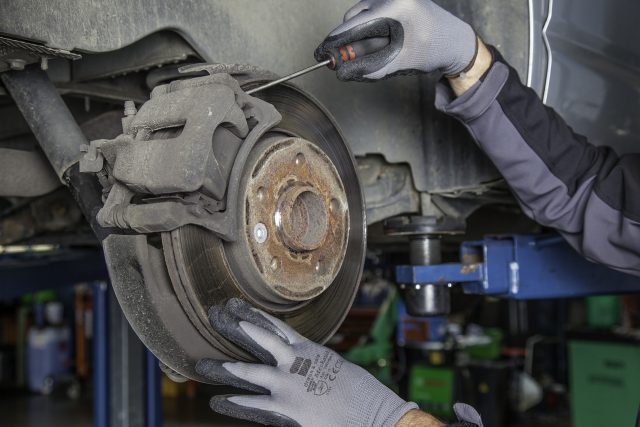 vehicle inspection checking brake disc and caliper in Perth